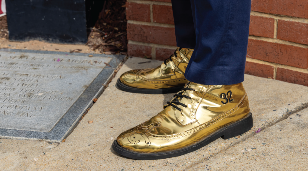 Jacques Gilbert, the 32nd mayor of Apex, North Carolina, wears a pair of metallic gold-toned boots with the number 32 emblazoned on the side.